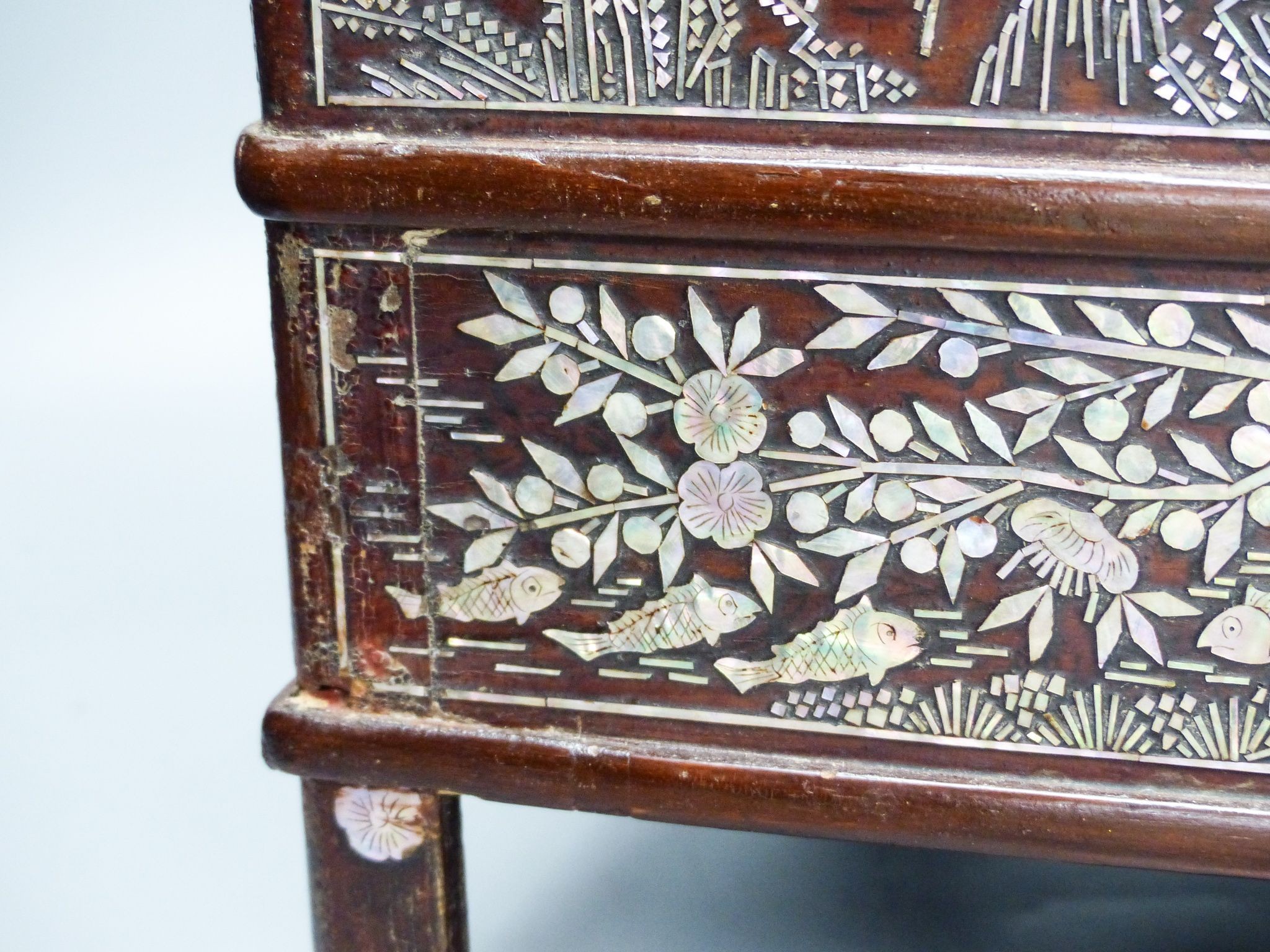 A 19th century Korean lacquered wood stove with mother of pearl inlay 38cm